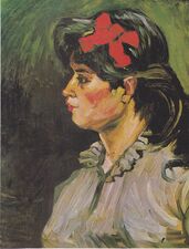 Portret van een vrouw met rode haarstrik