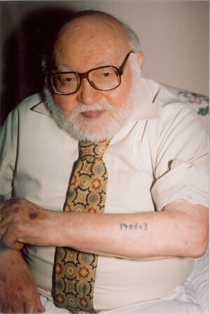 Auschwitz survivor displays tattoo.jpg